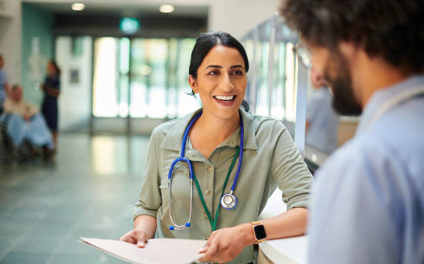 hospital doctor chatting to colleague